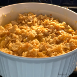 corn casserole in a white pyrex bowl