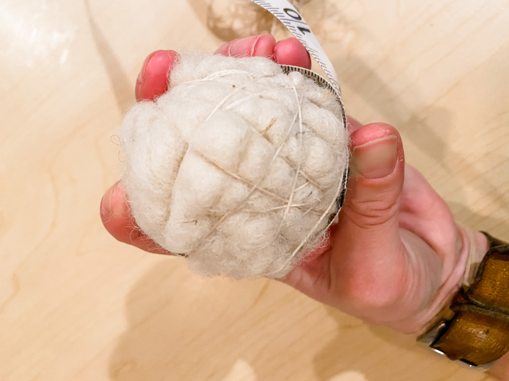 wool ball with string wrapped around it.