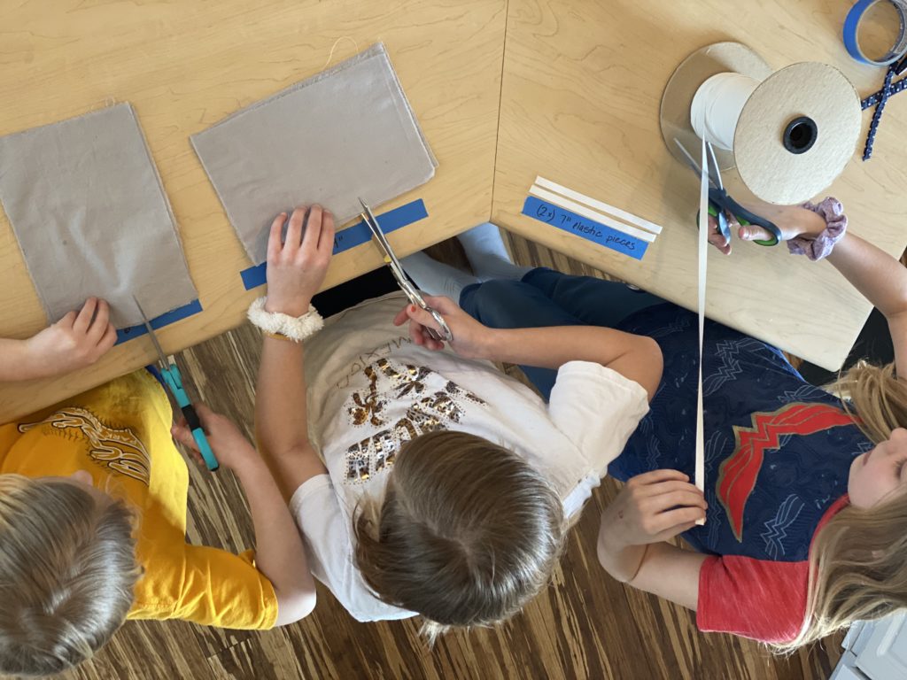 kids help making medical masks