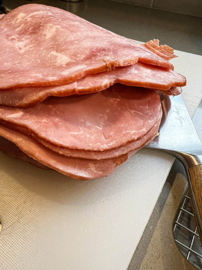 deli ham sitting on a cutting board