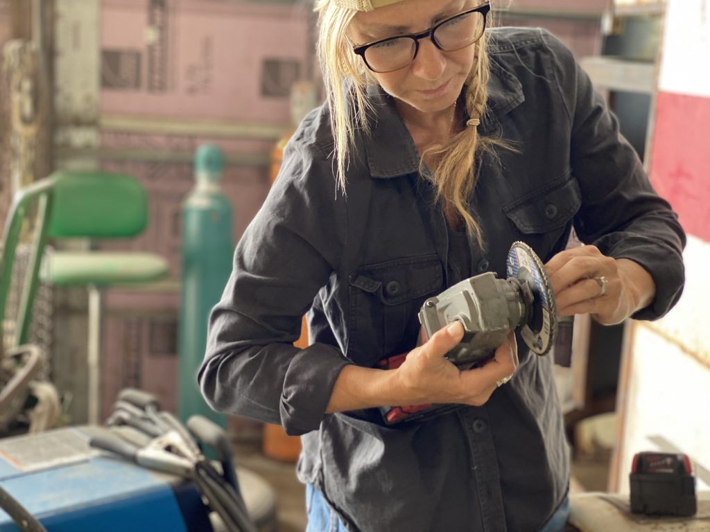 holding the grinder, changing the grinding wheel