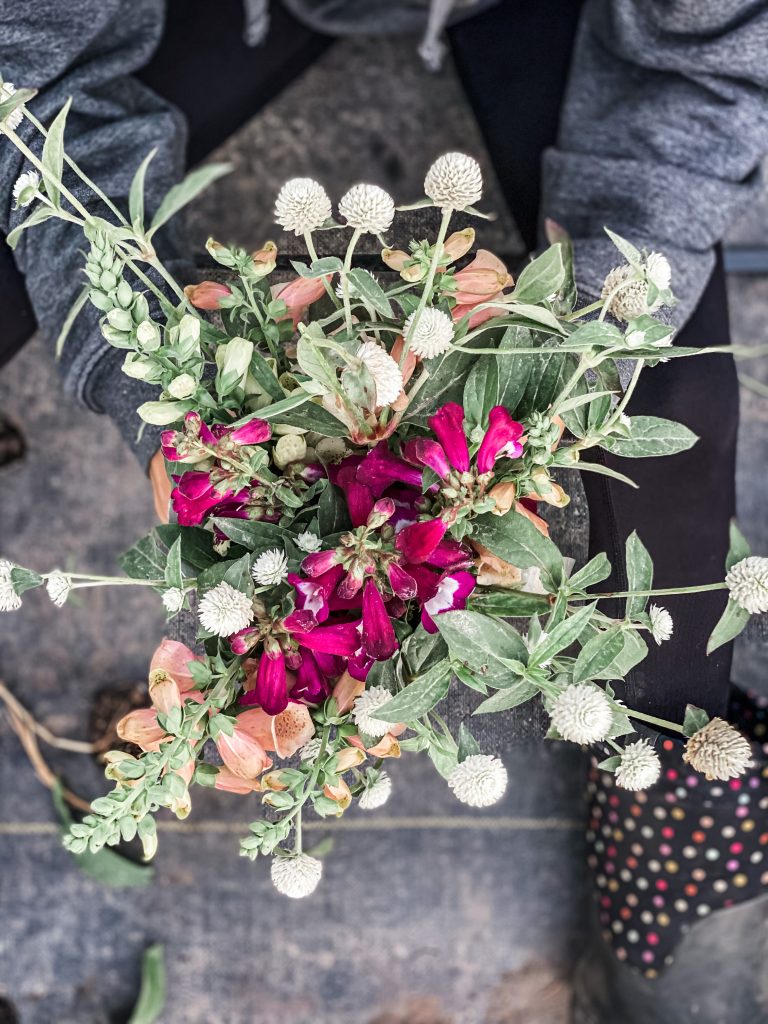 holding a bouquet of flowers