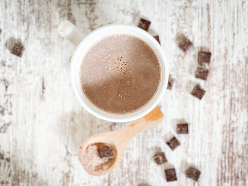 creamy hot cocoa in a white mug