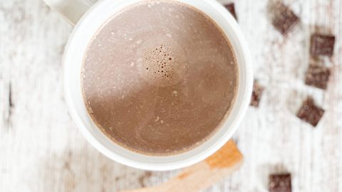 creamy hot cocoa in a white mug