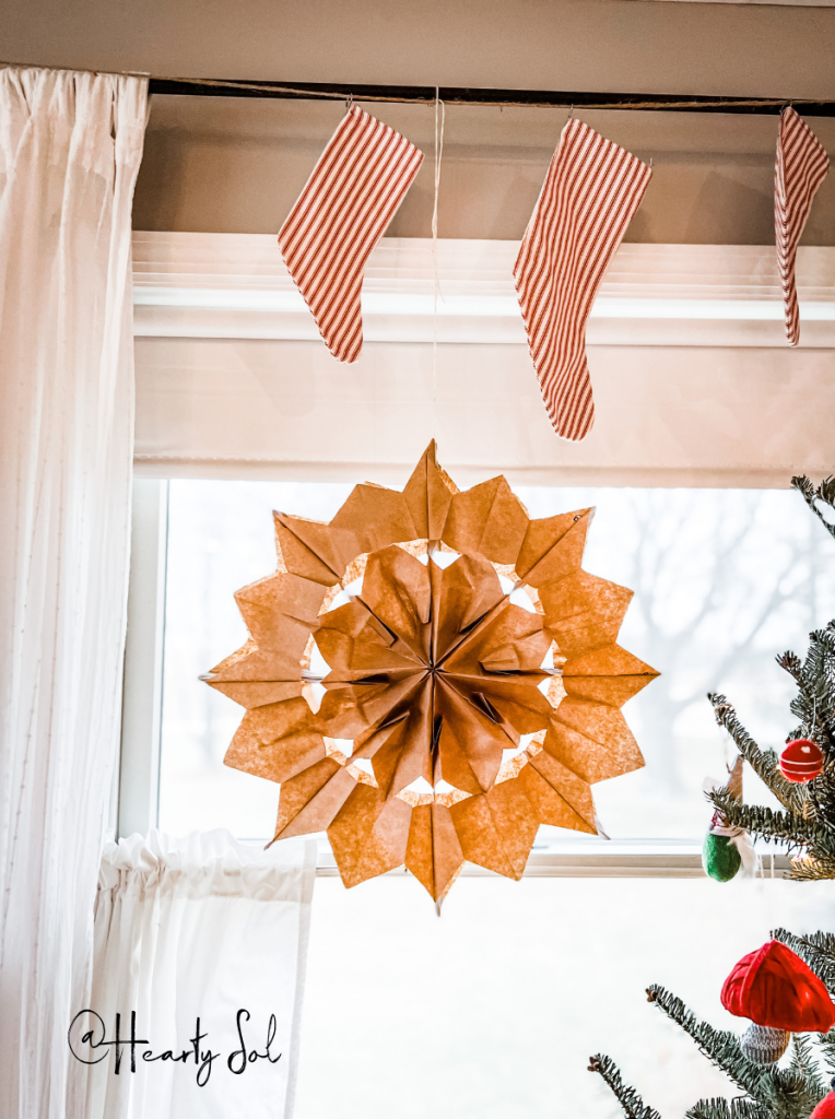 paper bag stars hanging in a window