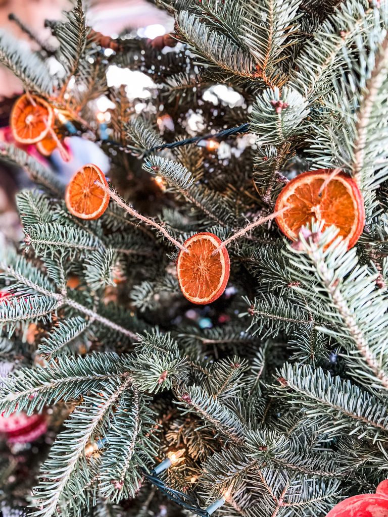 string of orange garland on tree