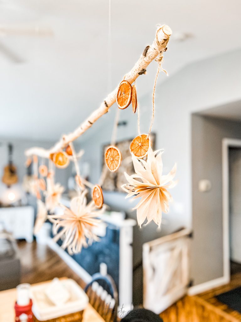 paper stars hanging with dried oranges