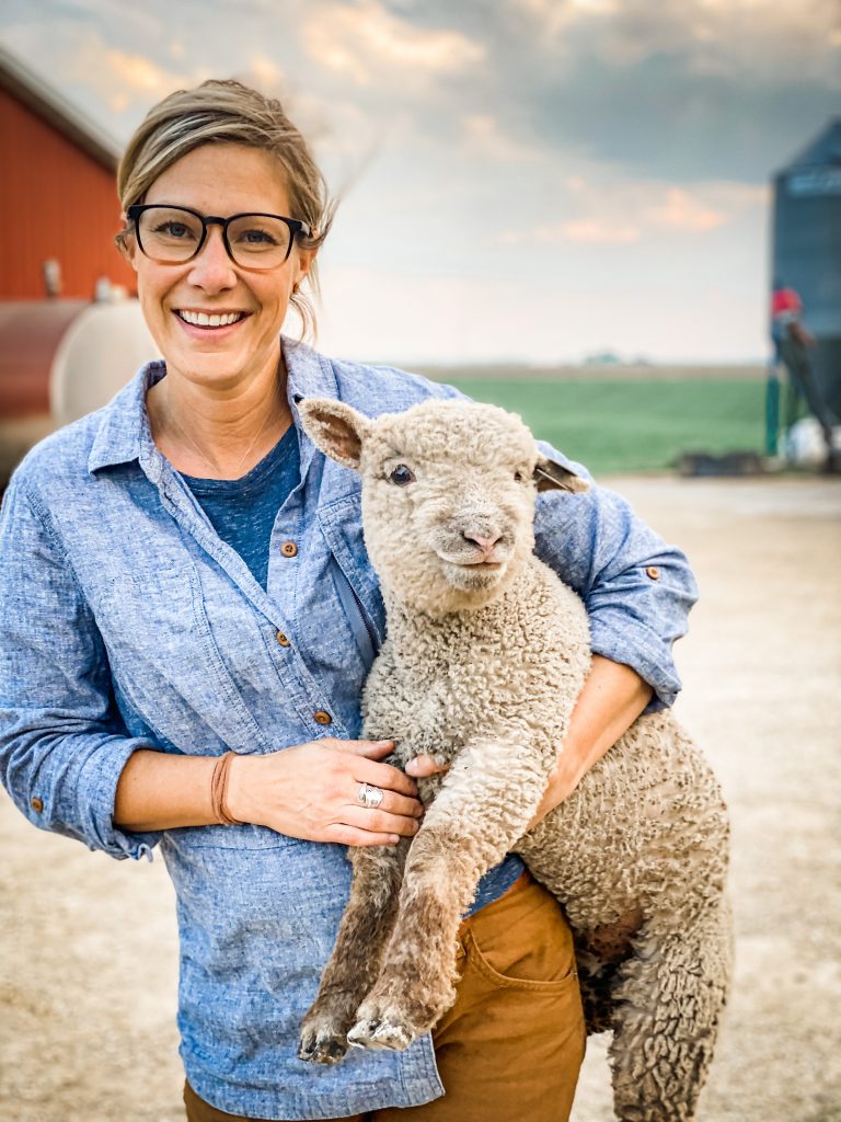 Holding one of our southdown babydoll lambs