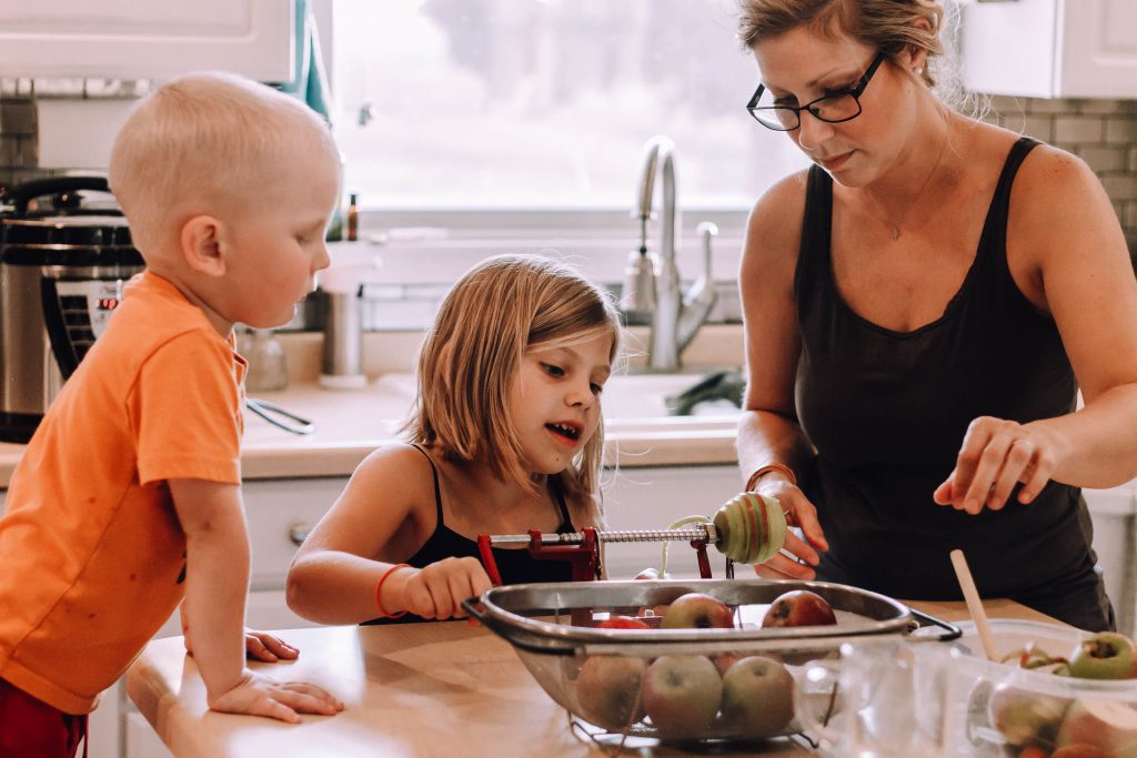 making apple sauce in the kitchen with the kids