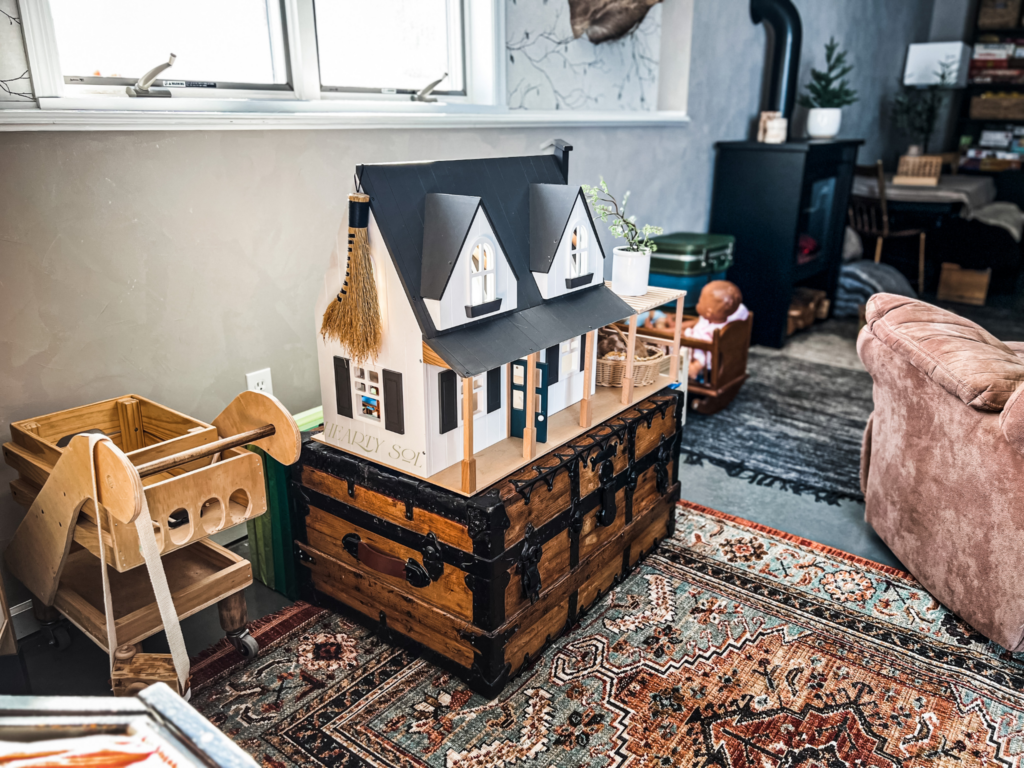 doll house against roman clay wall