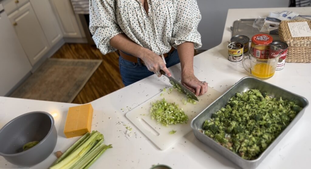 chopping up celery for the cheese broccoli dish