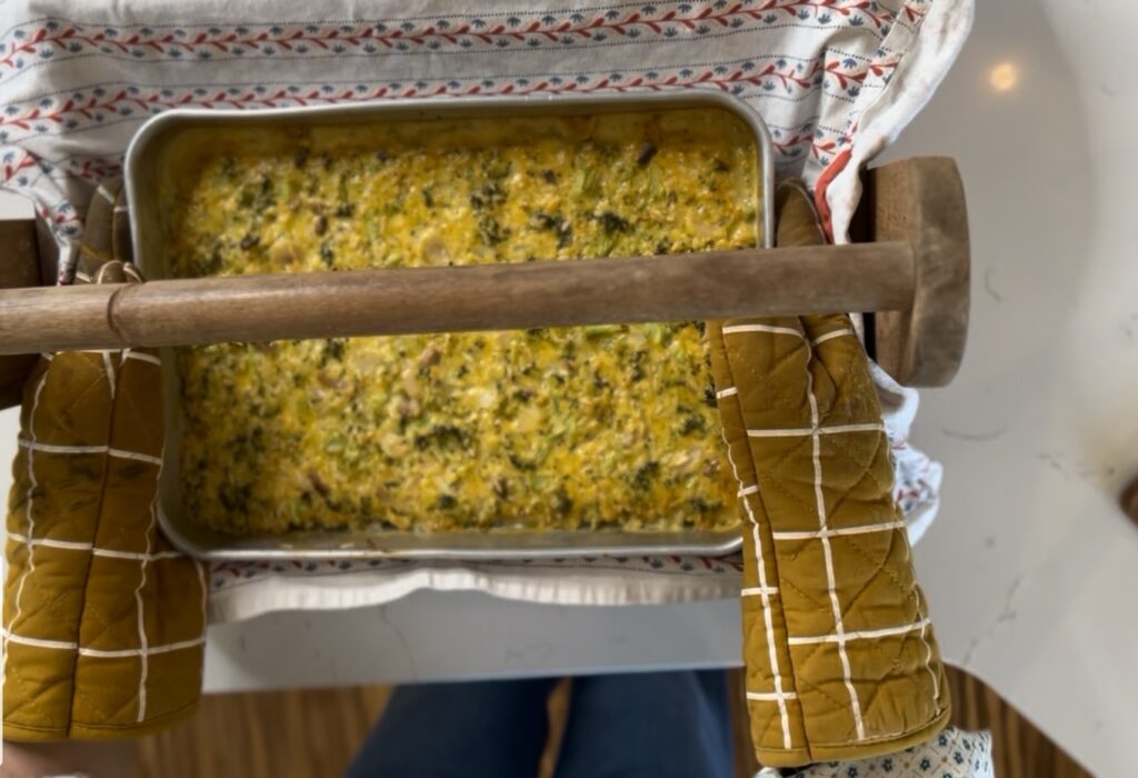 cheesy broccoli dish in wooden crate
