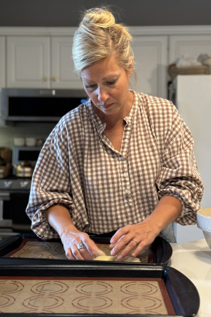 Placing sourdough on baking sheet