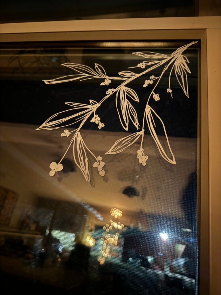 mistletoe painted on a window