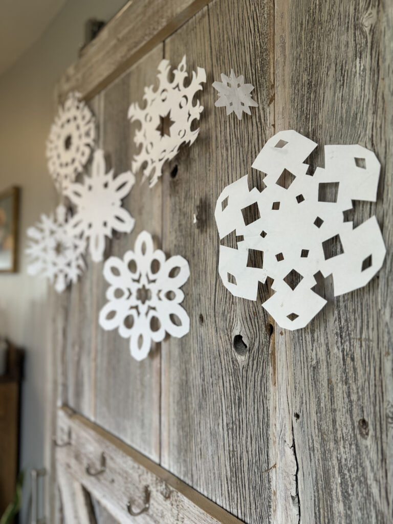 paper snowflakes on barn door