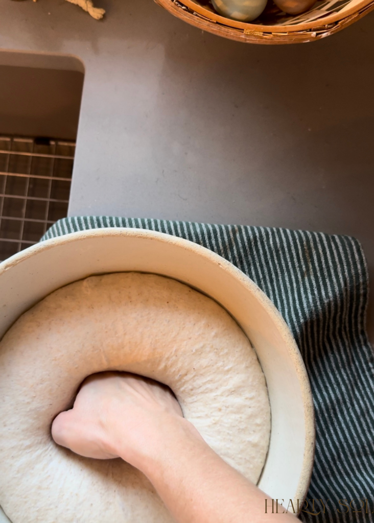 punching down a bread dough