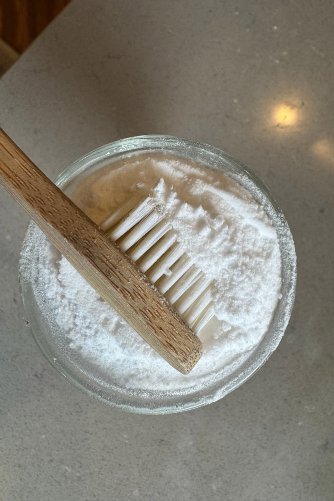 Dipping Toothbrush into Natural Toothpaste
