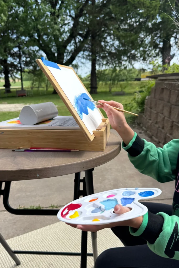 Child Painting Outside