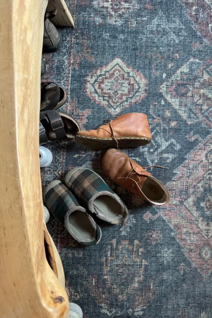 Shoes piled by the front door